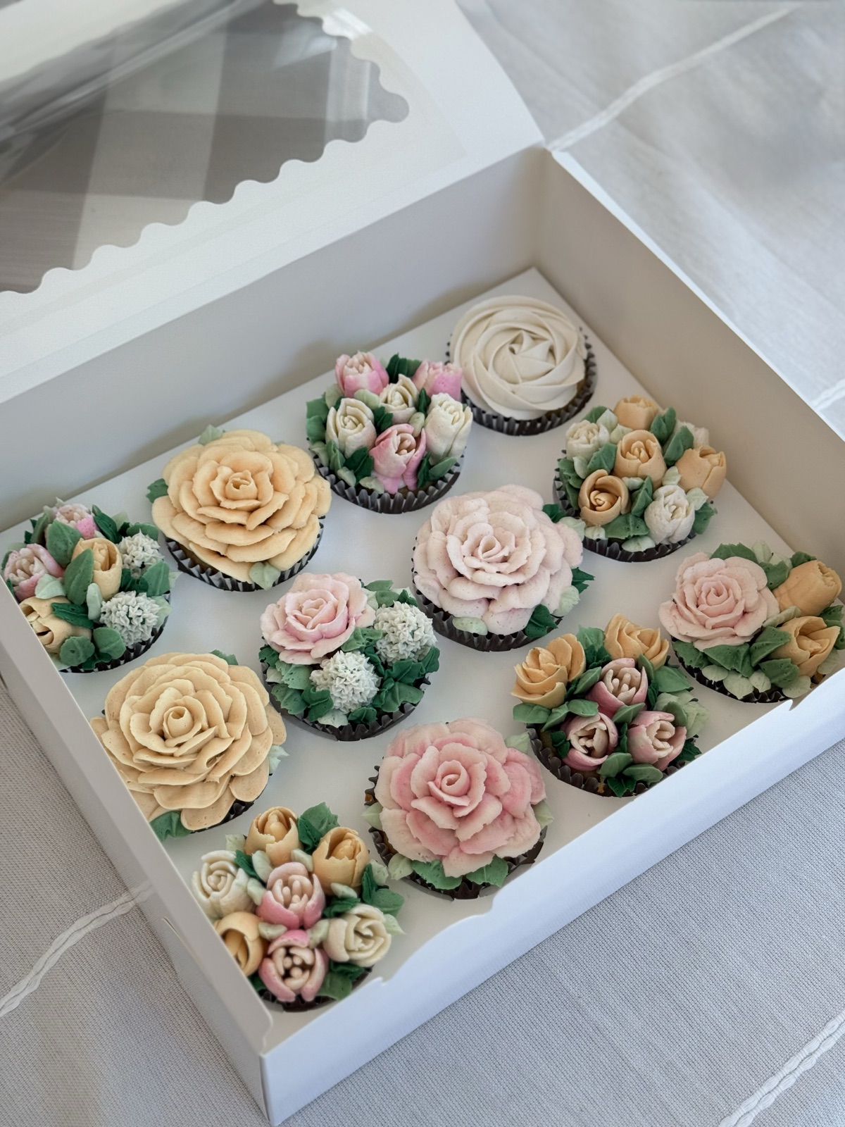 Close-up of a single box of buttercream flower cupcakes